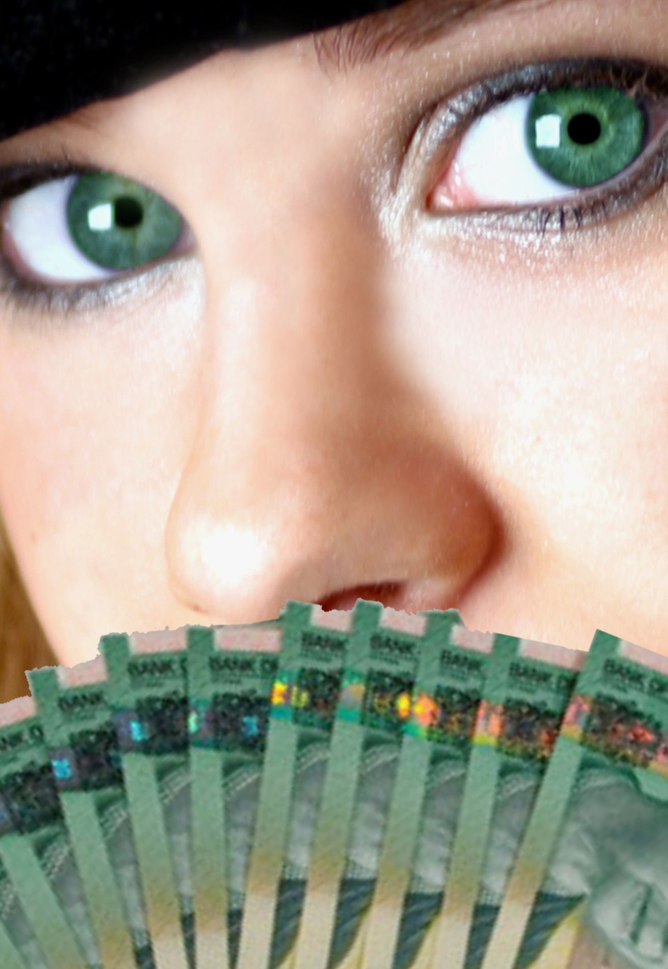 Green-eyed girl holding $20 Canadian bills | Website Design Pricing |HarrisWeb Creative | Milton