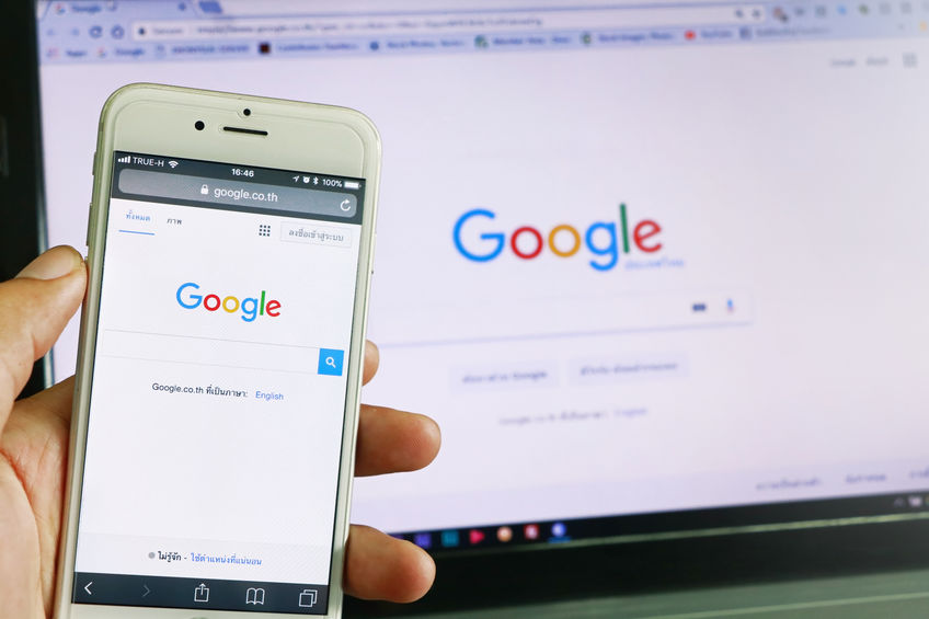 A smartphone and tablet showing Google Search on screen - Search Engine Optimization | HarrisWeb Creative