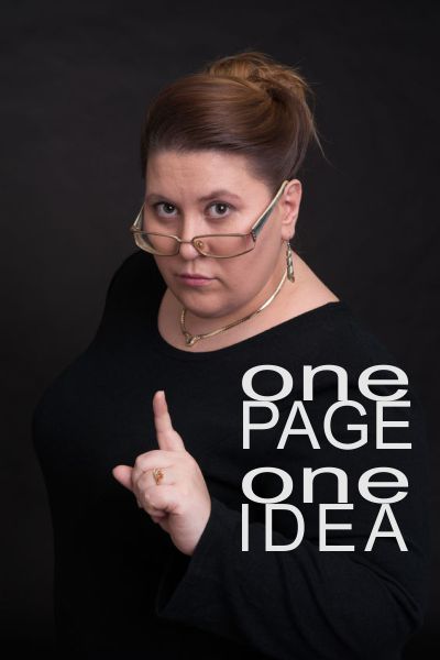 Woman holding up one finger - One Page One Idea - SEO | HarrisWeb Creative