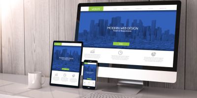 Modern responsive website shown on 4 varying-sized screens - Website Design | Harrisweb Creative